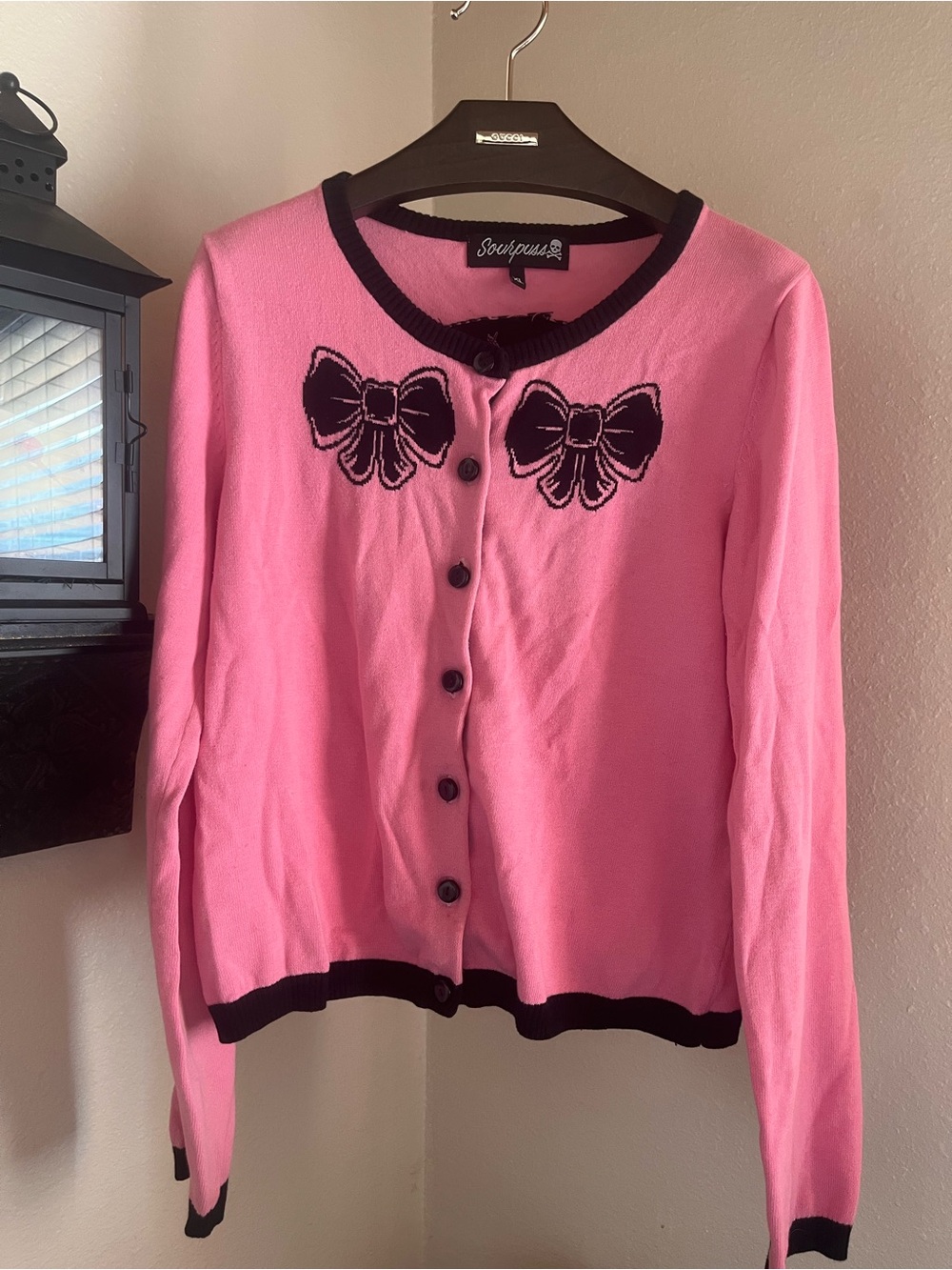 Sourpuss Pink Cardigan with Black Bow Appliqué